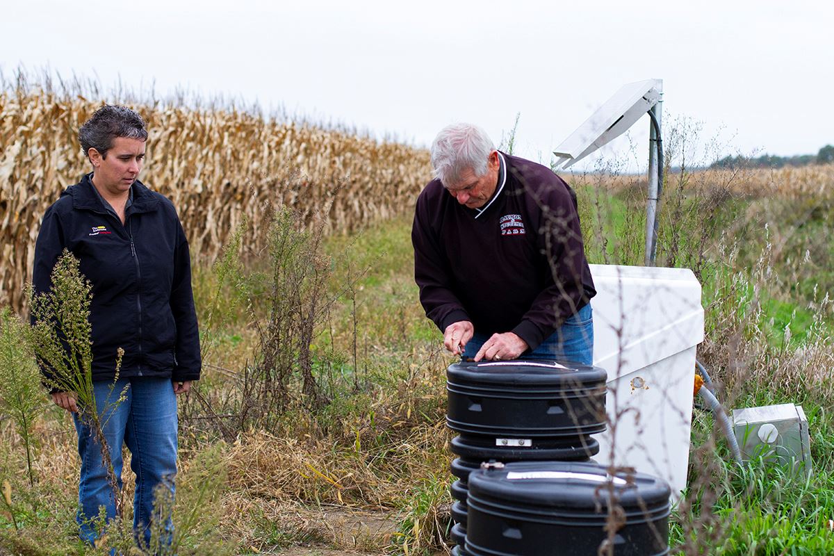 garrison and van wagner check the gates on a drainage system in Lenawee