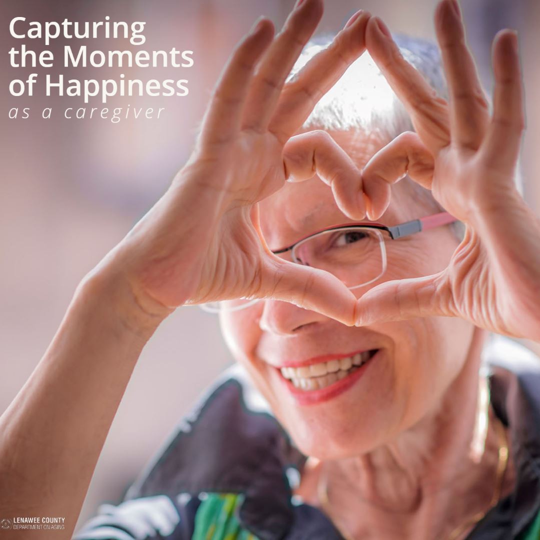 capturing the moments of happiness as a caregiver with woman smiling and making heart sign
